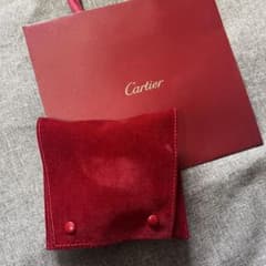 Cartier red watch accessory pouch with shopping bag.