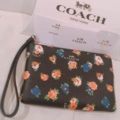 【箱付き新品未使用】コーチ 花柄 薄型ポーチのサムネイル