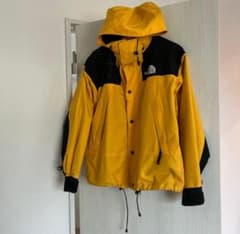 処分】THE NORTH FACE マウンテンパーカー イエロー - メルカリ