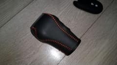 シフトノブカバー 黒とオレンジ ステッチのサムネイル