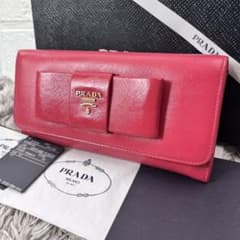 PRADA フィオッコ サフィアーノ メタルロゴ リボン 長財布 ピンク