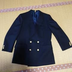 ネイビー ダブルブレストジャケット金色のボタン付き