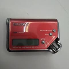 SONY Network Walkman NW-E75 Red, runs on AAA batteries.