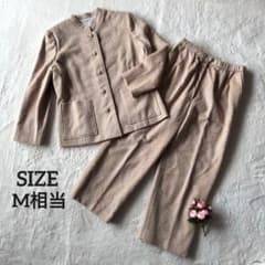 Retro vintage clothing set: Jacket and wide-leg pants with embroidery and pearl buttons, beige.