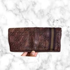 グッチの革財布　長財布　スプリーム シェリーライン ラウンドファスナー　茶色