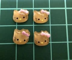 日焼けキティ　ネイルパーツ 4個セットのサムネイル