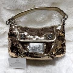 COACH スパンコール ワンハンド ポピー ゴールド - メルカリ