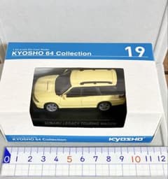 新品 未開封 / 京商64 レガシィ 黄色 / ファミマ限定 スバル レガシーのサムネイル