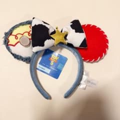 香港ディズニー トイストーリー ジェシーカチューシャ 新品タグ付き