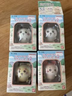Chiikawa, a small and cute doll, a calico Shisa.