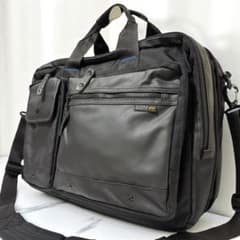 Excellent condition Alpha Industries 2-way briefcase with blue lines and water-repellent finish