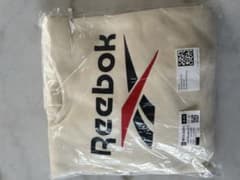 【H&M✖️Reebok 】フード付きパーカー クリーム色のサムネイル