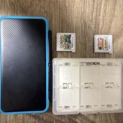 New 2DS LL 青 + ゲーム2本セットカセットケース付きのサムネイル