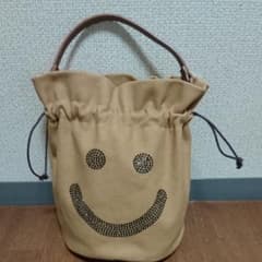 【お値下げ】キャンパス地ニコちゃんバッグ 黄色 ブラウンのサムネイル