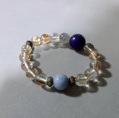 Bracelet featuring lapis lazuli, labradorite, angelite, and bronze shine crystal.
