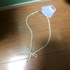 白リボンネックレス　100円のサムネイル