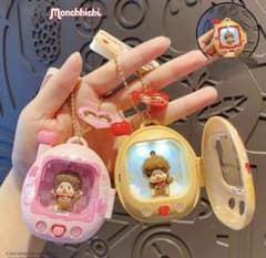 たまごっち モンチッチ 光るキーホルダー 2個セット - メルカリ