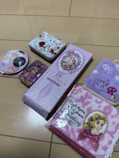 Disney Princess merchandise bundle: Rapunzel hand mirror, towel, and more.