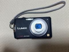 Panasonic Lumix DMC-FX700 digital camera with tripod (operation confirmed).