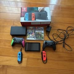 Nintendo Switch 本体とコントローラー2個セット カセット2個 - メルカリ