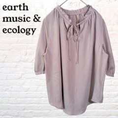 Earth Music & Ecology blouse with frills and ribbon, in muted colors.