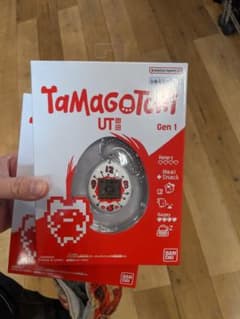 新品　ユニクロ　たまごっち ホワイト２個　UNIQLOのサムネイル