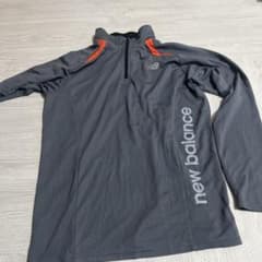New Balance ブラック 長袖ハーフジップシャツ