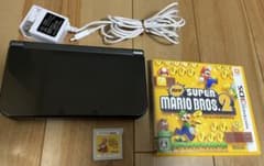 Newニンテンドー3DS LL メタリックブラック＋ゲームソフト2つのサムネイル