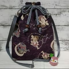 Drawstring cross-body bag with zipper closure, reversible, featuring Fujin and Raijin (wind and thunder gods) and flowing water with carp design, perfect for festivals.