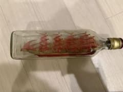 Bottle ship, red sail ship, glass, antique item.