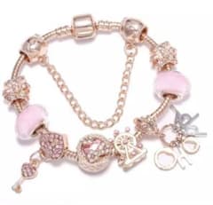 Happy charm and two crown bead bracelet, pink charm.