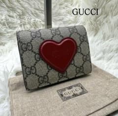 ✨️美品✨️GUCCI ハート型ロゴ 二つ折り財布 GGスプリーム - メルカリ