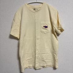 UT KAWS ポケットTシャツ Sサイズ クリームイエローのサムネイル