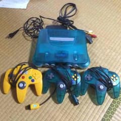 ニンテンドー64、コントローラー、カセット付きのサムネイル