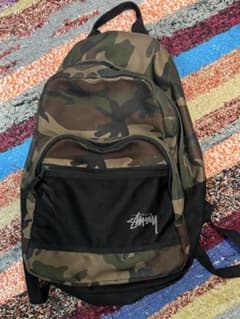 STUSSY☆STOCK BACKPACK カモ柄リュック - メルカリ