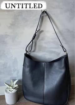 Excellent condition UNTITLED black A4 shoulder bag with gusset.