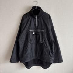 FILA ハーフジップ ナイロンジャケット 内側フリース 黒 古着 90sのサムネイル