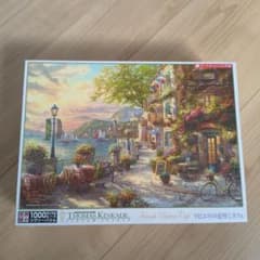 トーマスキンケード 1000ピース ジグソーパズル リビエラの花咲くカフェのサムネイル