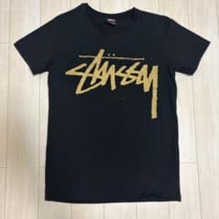 STUSSY ステューシー Tシャツ ブラック ゴールドロゴ Mのサムネイル