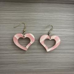 Heart-shaped earrings with pink and white stripes