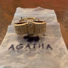 カウントダウン値下げ AGATHAスワロゴールドリボンリングのサムネイル