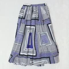 All-over print long skirt, geometric pattern, size L, elastic waistband, unique, retro, A-line silhouette.