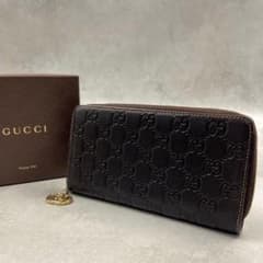 GUCCI ダークブラウン シマ ラウンドファスナー 8453 GUCCI ダークブラウン シマ ラウンドファスナー 8453 - メルカリ