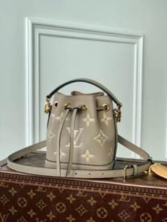 Louis Vuitton beige bucket bag