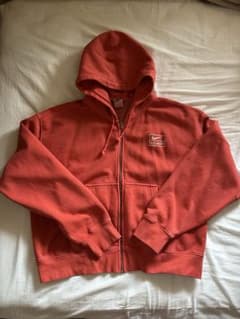 NikeSTUSSYオレンジ ジップアップパーカー M - メルカリ
