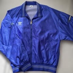 adidas トレフォイル ナイロンジャケット ブルー Lサイズのサムネイル