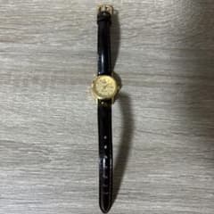 CASIO watch, gold dial, brown leather strap.