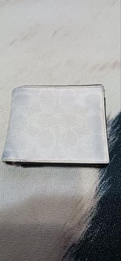 COACH　二つ折り財布のサムネイル