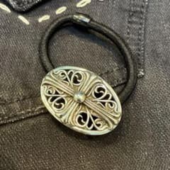 Openwork silver floral cross concho hair tie, silver color bracelet