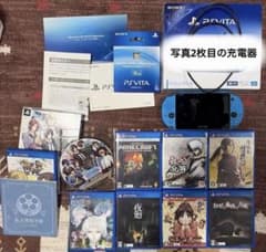 PlayStation Vita console, 8 games, and memory card / near mint condition